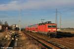 Das beste Foto des Tages,143 818-3 war mit ihrer RB 21 im sch�nsten Abendlicht auf dem Weg nach Potsdam,hier im ehemaligen Bahnhof von Satzkorn abgelichtet (12.02.11)