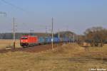 Neuer Nachschub f�r die Westdeutschen �fen,welcher von der am Vortag bereits gesichteten 185 390-2 bef�rdert wurde,donnert hier am kleinen �rtchen Nudow durch die Felder (03.03.11)