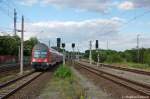 112 184-7 verl�sst gerade mit einer RE2  Ersatzgarnitur  als (RE 37387) von Rathenow nach K�nigs Wusterhausen den Rathenower Bahnhof.