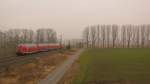 Ein RE 5 nach Lutherstadt Wittenberg geschoben von 114 034 am 05.03.2011 bei der Einfahrt in Trebbin.